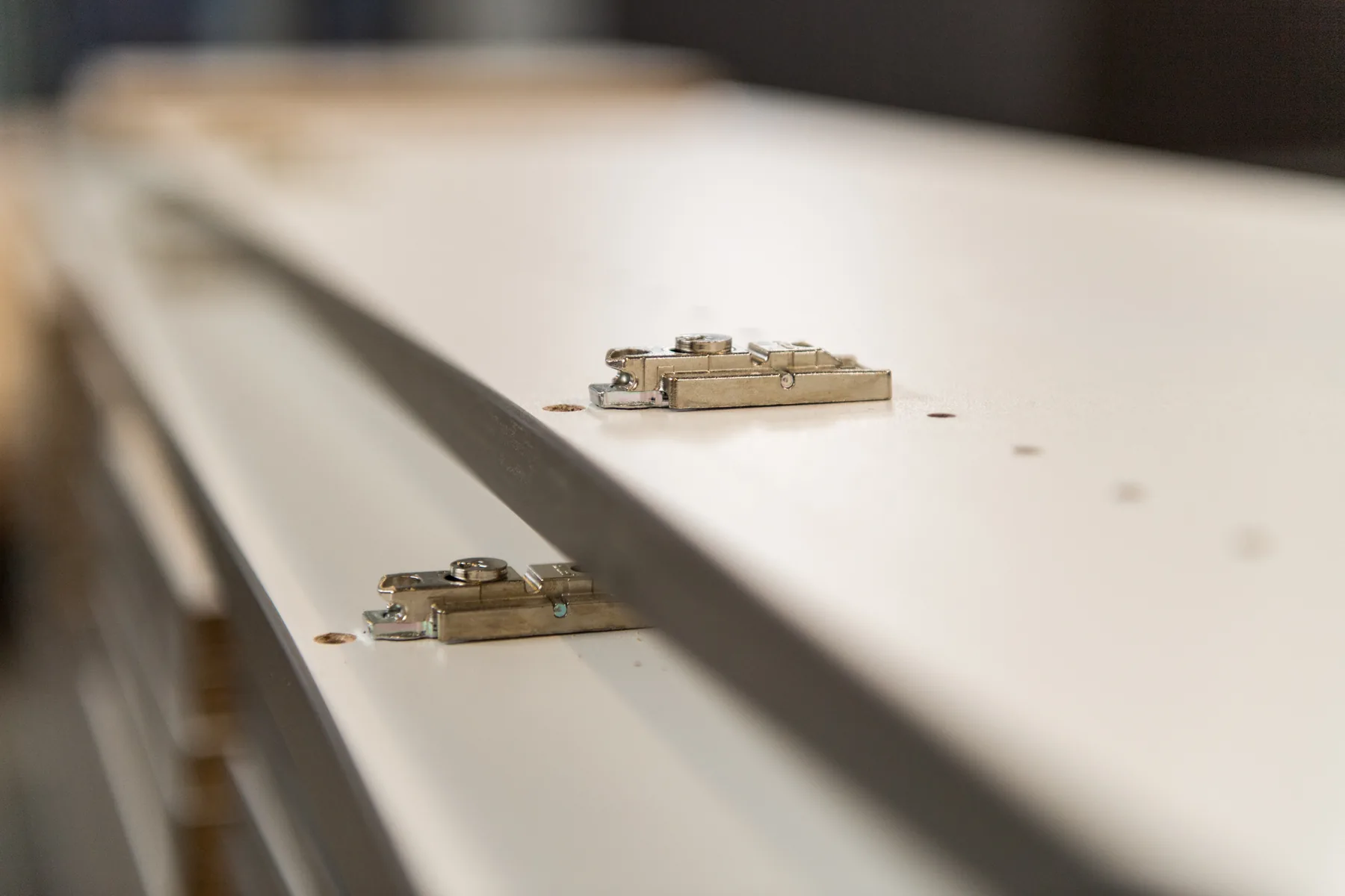 Consistently positioned mounting plates on panel parts